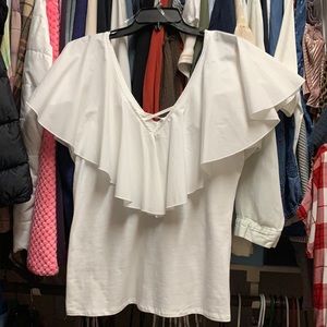 Sleeveless, fitted tee with flutter collar. No tags, but has never been worn.